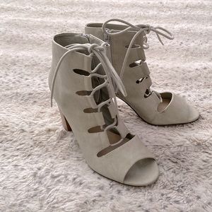 Lace up, open toe booties. Light grey with 4” tan heel.